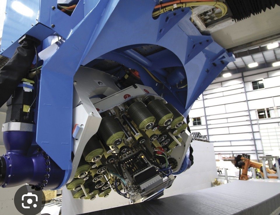 Multi-spool automated fiber placement end effector feeding several tows