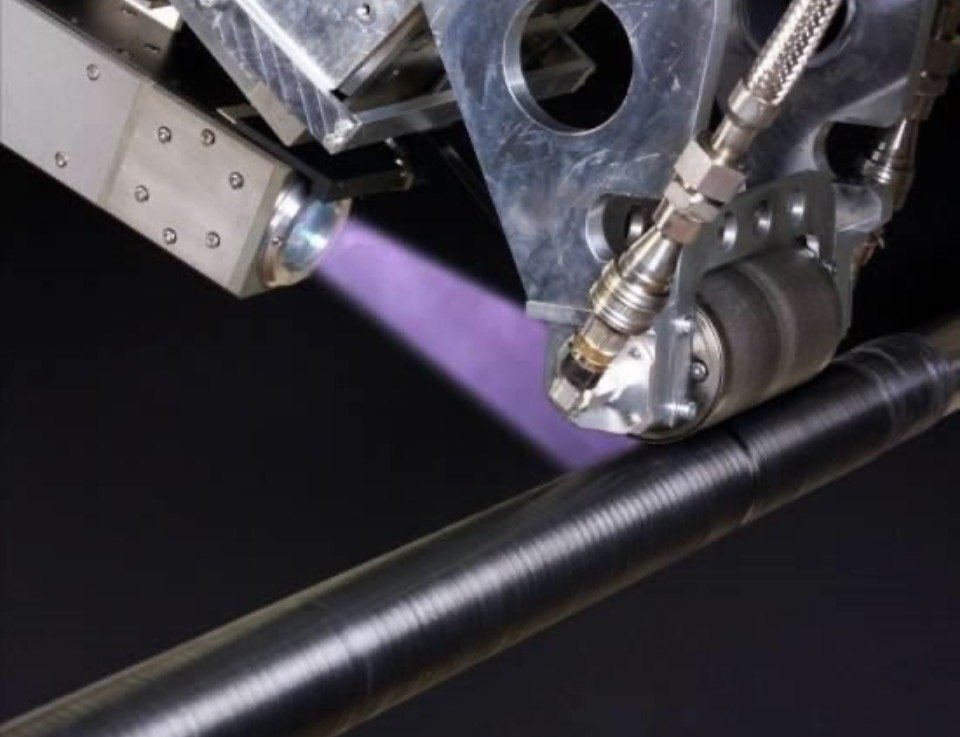 In-situ consolidation of tow during automated fiber placement, showing a heating spot on the substrate